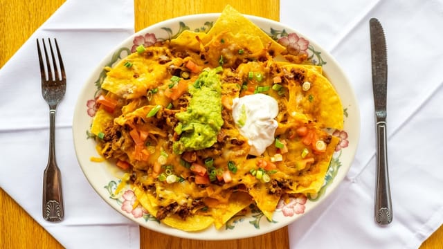 2. Nachos with Carnitas, Ground Beef, Chicken or Beans.
