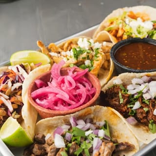 Cochinita Pibil Tacos (Pork Cushion Marinated for 24 Hours with Banana Leaves with Our Famous Grandma's Recipe)